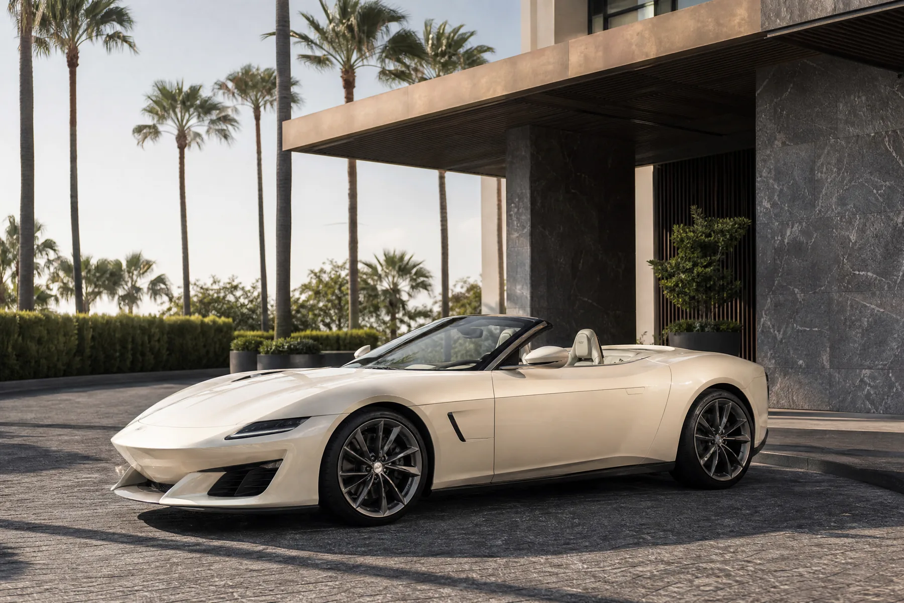 Pearl white open-top performance car at a modern Southern California hotel