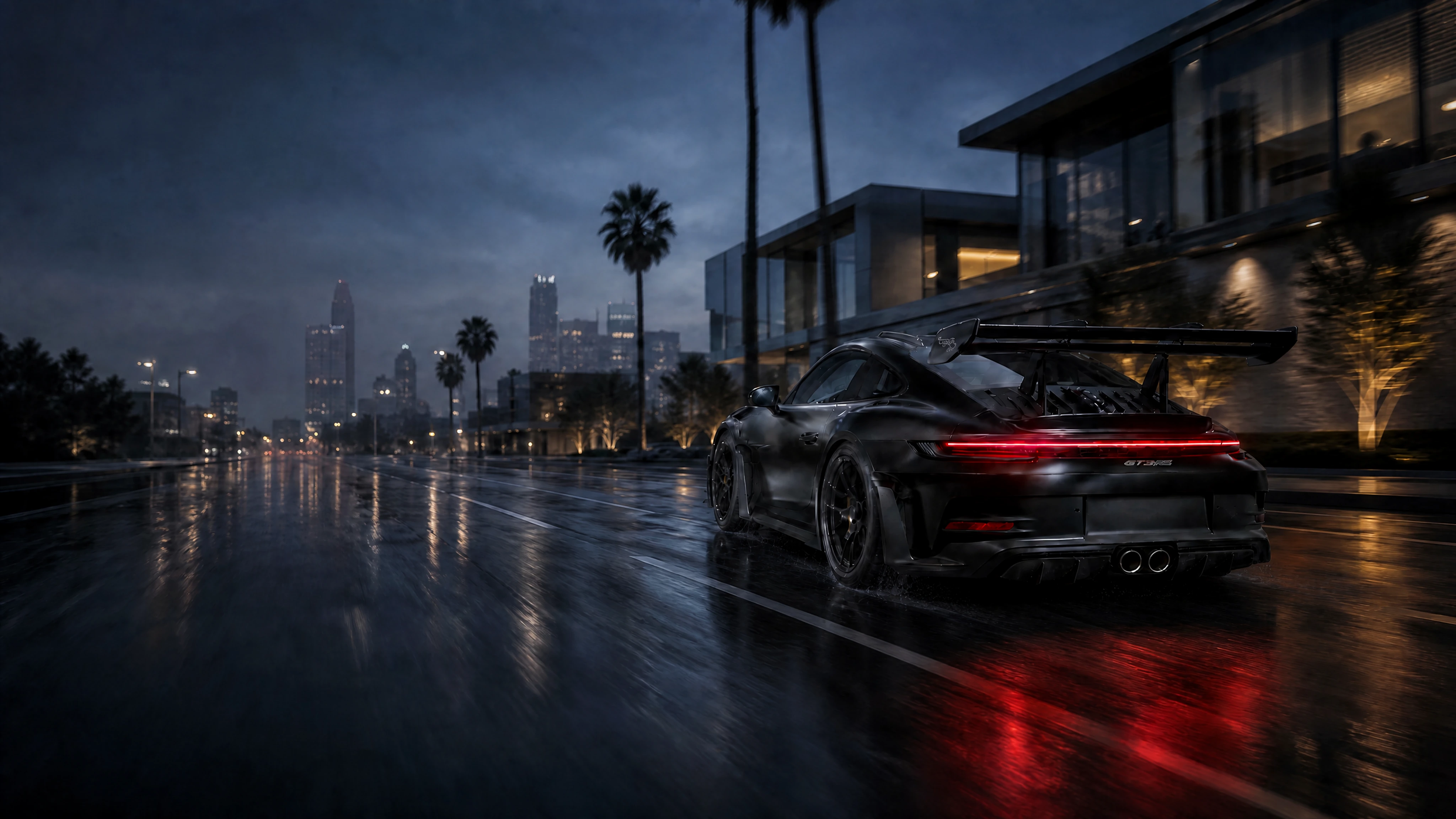 Satin-black Porsche 911 992 GT3 RS grounded on a rain-darkened Los Angeles boulevard with glowing red taillights